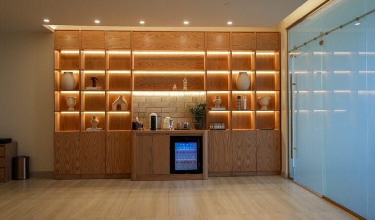 Pilates studio reception wooden shelves interior design Riyadh - Meraki Design Build