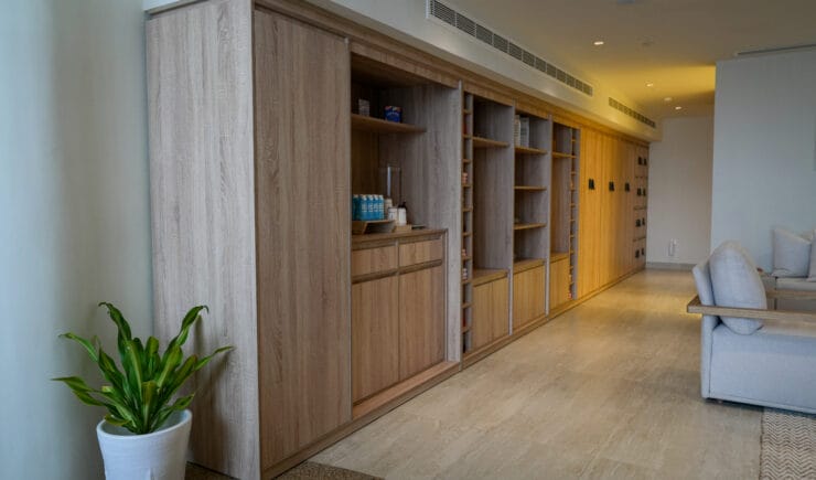 Wellness studio corridor wooden shelving interior design Riyadh - Meraki Design Build